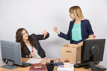 Image showing Office employee humiliating gesture of laid-off colleagues who fights back