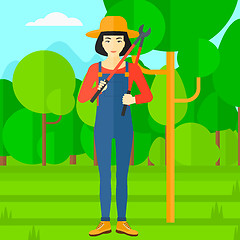 Image showing Farmer with pruner in garden.