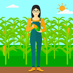 Image showing Farmer holding corn.