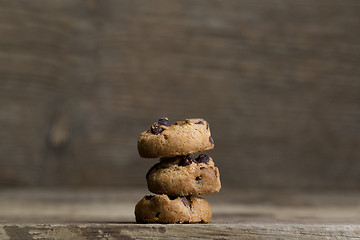 Image showing Brown cookies on wooden background