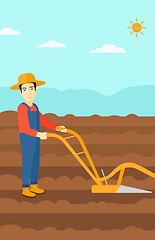 Image showing Farmer on the field with plough.