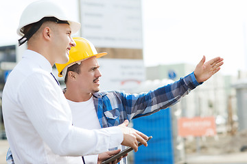 Image showing builder and architect with tablet pc outdoors