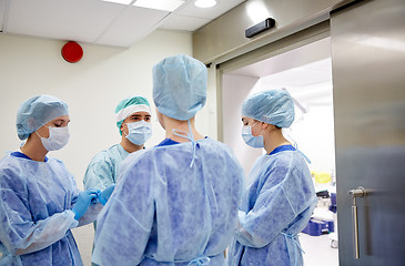 Image showing group of surgeons in operating room at hospital