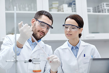 Image showing young scientists making test or research in lab