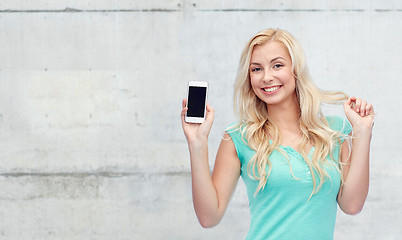 Image showing happy young woman or teenage girl with smartphone