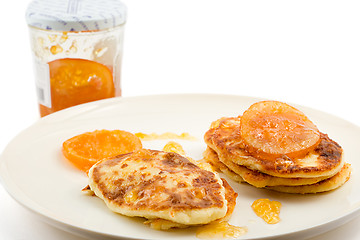 Image showing small cottage pancakes with orange jam