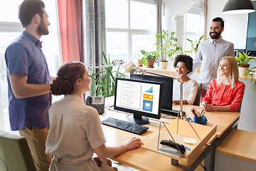 Image showing happy creative team talking in office