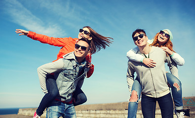Image showing happy teenage friends having fun outdoors