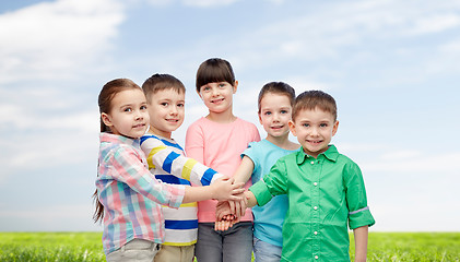 Image showing happy little children with hands on top