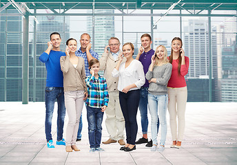 Image showing group of smiling people with smartphones