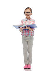 Image showing happy little girl in eyeglasses reading book