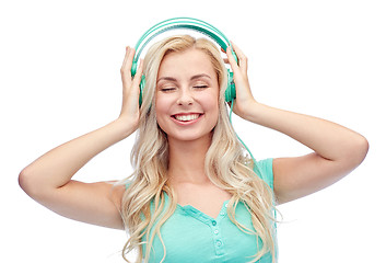 Image showing happy young woman or teenage girl with headphones