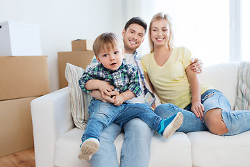 Image showing happy family with boxes moving to new home