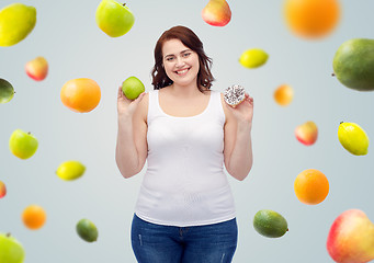 Image showing happy plus size woman choosing apple or cookie