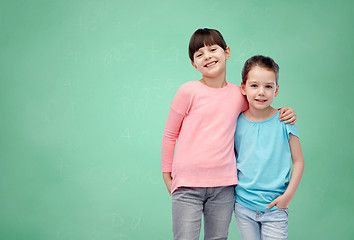 Image showing happy smiling little girls hugging