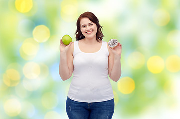 Image showing happy plus size woman choosing apple or cookie