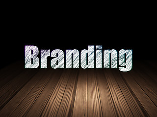 Image showing Marketing concept: Branding in grunge dark room