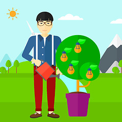 Image showing Man watering tree with light bulbs.