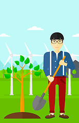 Image showing Man plants tree.