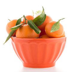 Image showing Tangerines on ceramic orange bowl 