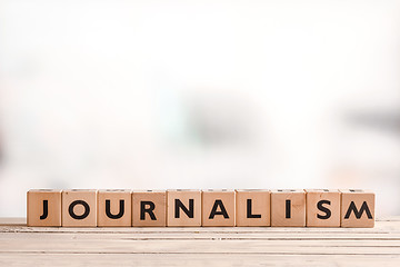 Image showing Journalism sign on a bright table