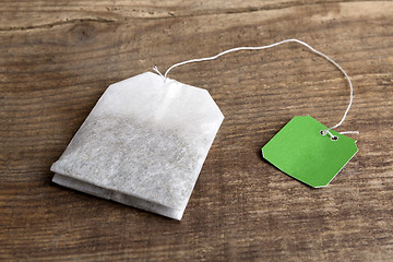 Image showing Teabag on wooden background   