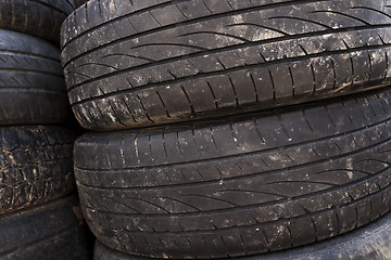 Image showing used car tires. close-up  