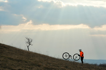 Image showing Man cyclist with backpack riding the bicycle