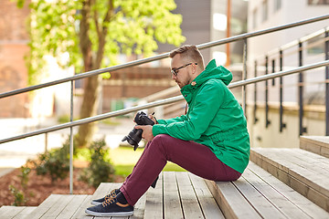 Image showing young hipster man with digital camera in city