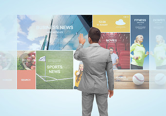 Image showing businessman with virtual projection of news pages