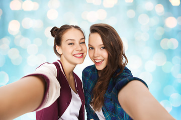 Image showing happy smiling pretty teenage girls taking selfie