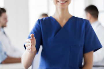 Image showing close up of doctor reaching out hand at hospital