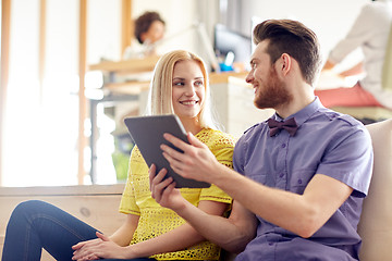 Image showing happy creative team with tablet pc in office