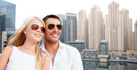 Image showing happy couple in shades over dubai city background