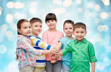 Image showing happy little children with hands on top