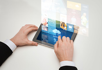 Image showing close up of man hands with web pages on tablet pc