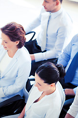 Image showing businessmen and businesswomen on conference