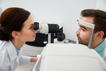 Image showing optician with tonometer and patient at eye clinic