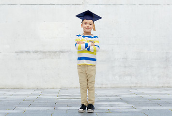 Image showing happy boy in bachelor hat or mortarboard