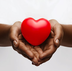 Image showing female hands with small red heart