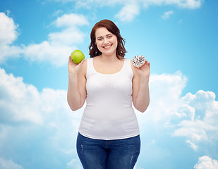 Image showing happy plus size woman choosing apple or cookie