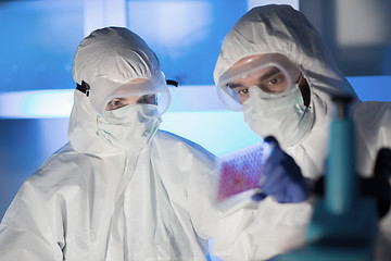 Image showing close up of scientists making test in chemical lab