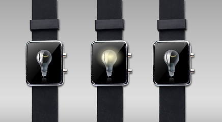 Image showing close up of smart watch with light bulb on screen