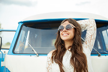 Image showing smiling young hippie woman in minivan car