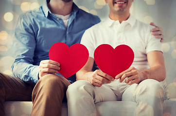 Image showing close up of happy gay male couple with red hearts
