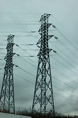Image showing Electric powerlines on a gray sky