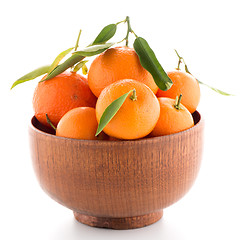 Image showing Tangerines on wooden  bowl 