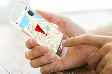 Image showing close up of hand with navigator map on smartphone