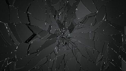 Image showing Broken and cracked shapp glass on black