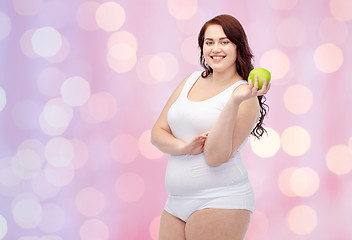 Image showing happy plus size woman in underwear with apple
